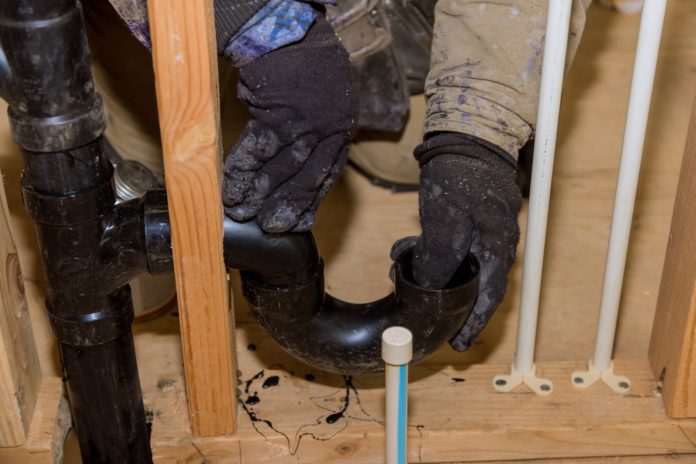 plumber repairing sewer